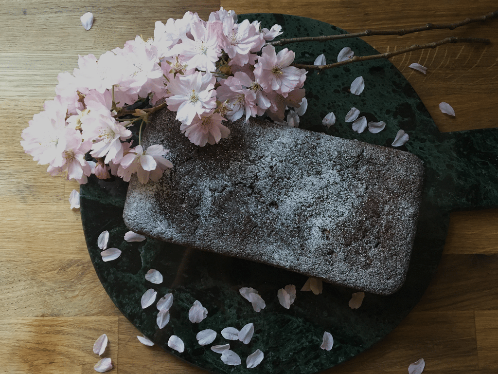 Vegan Ginger Cake on marble with Pink Blossom