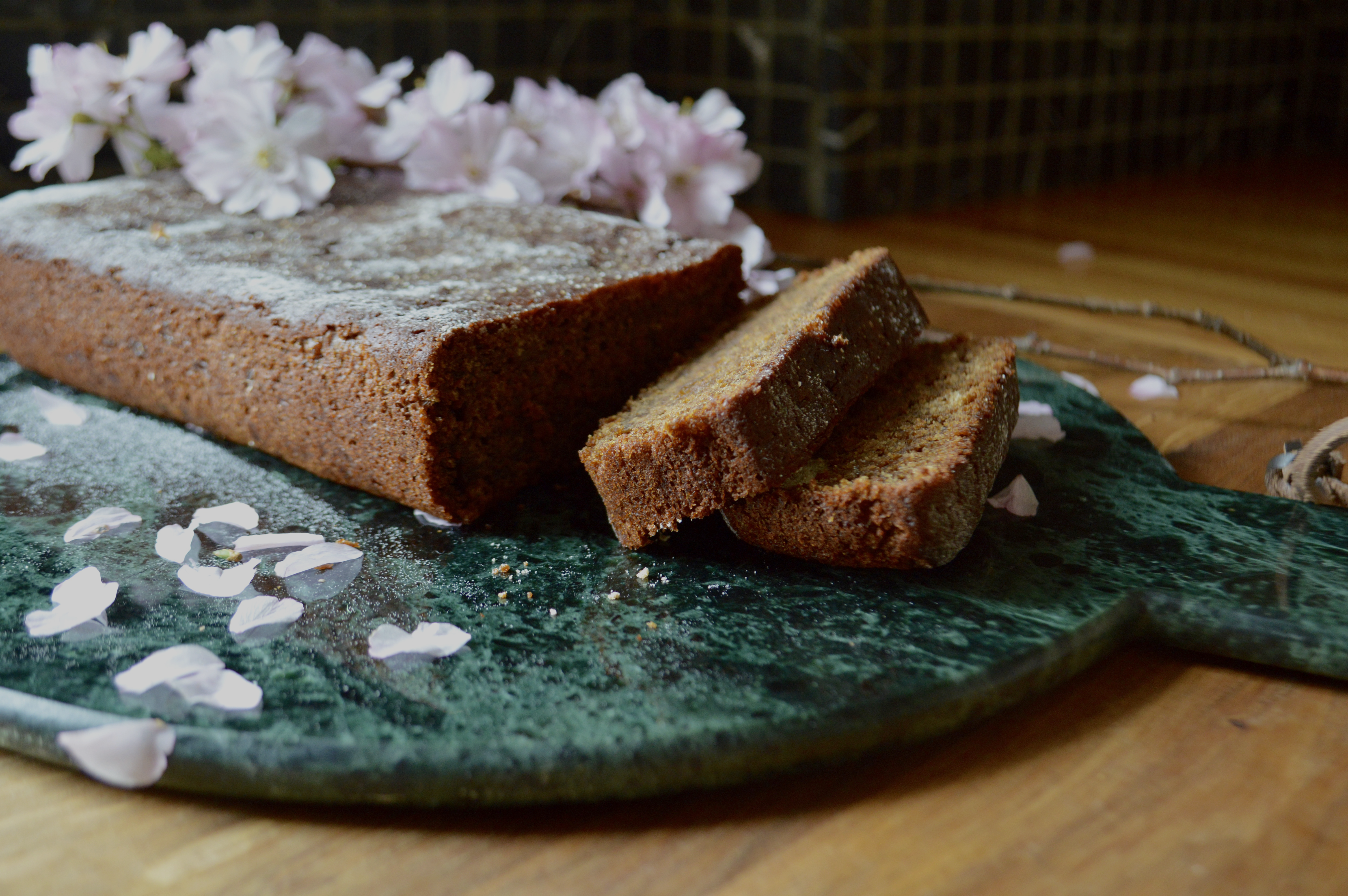 Vegan Gingerbread on Marble with Pink Blossom Closeup