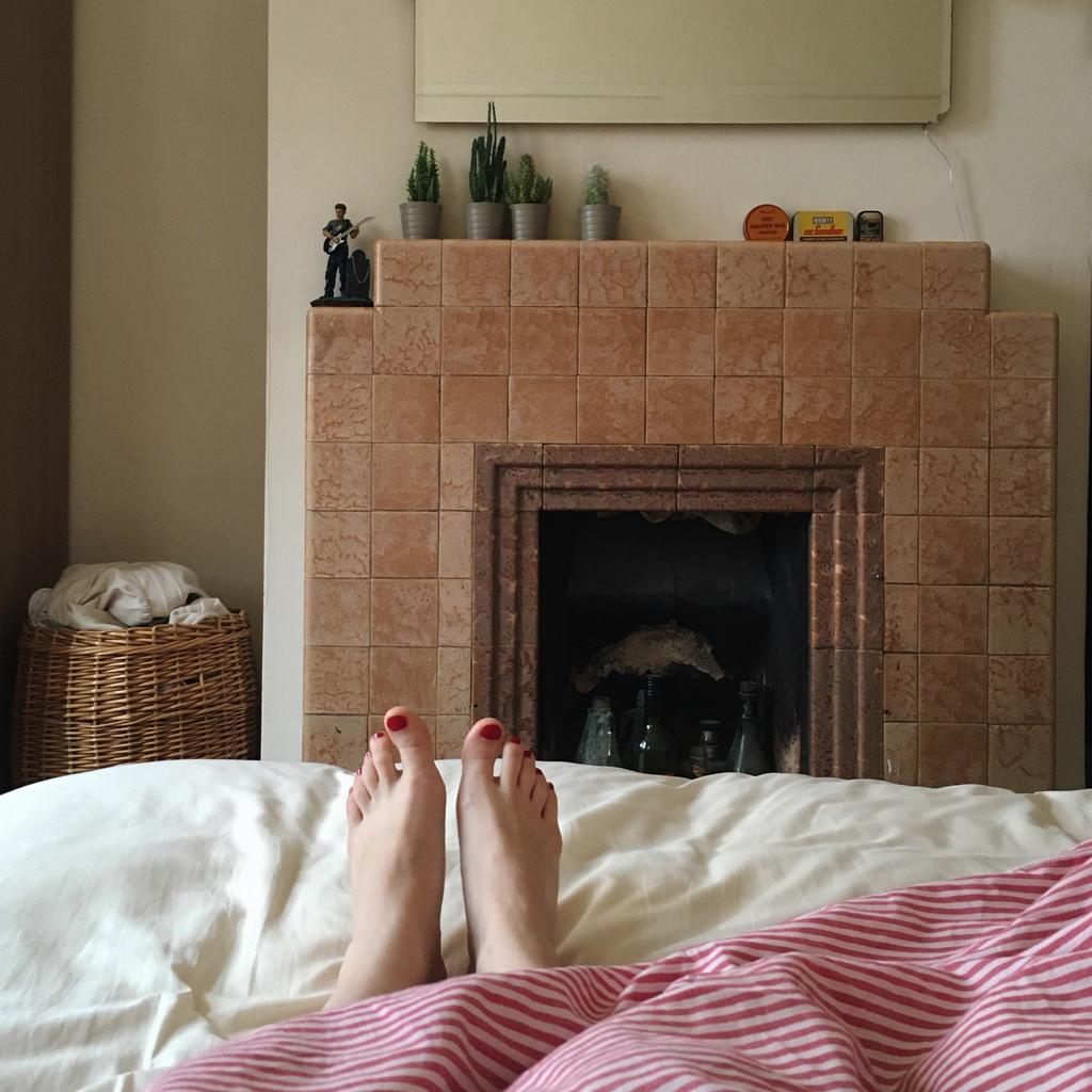 Farewell Number 35, View of Feet in Bed, Striped Bed Sheets,