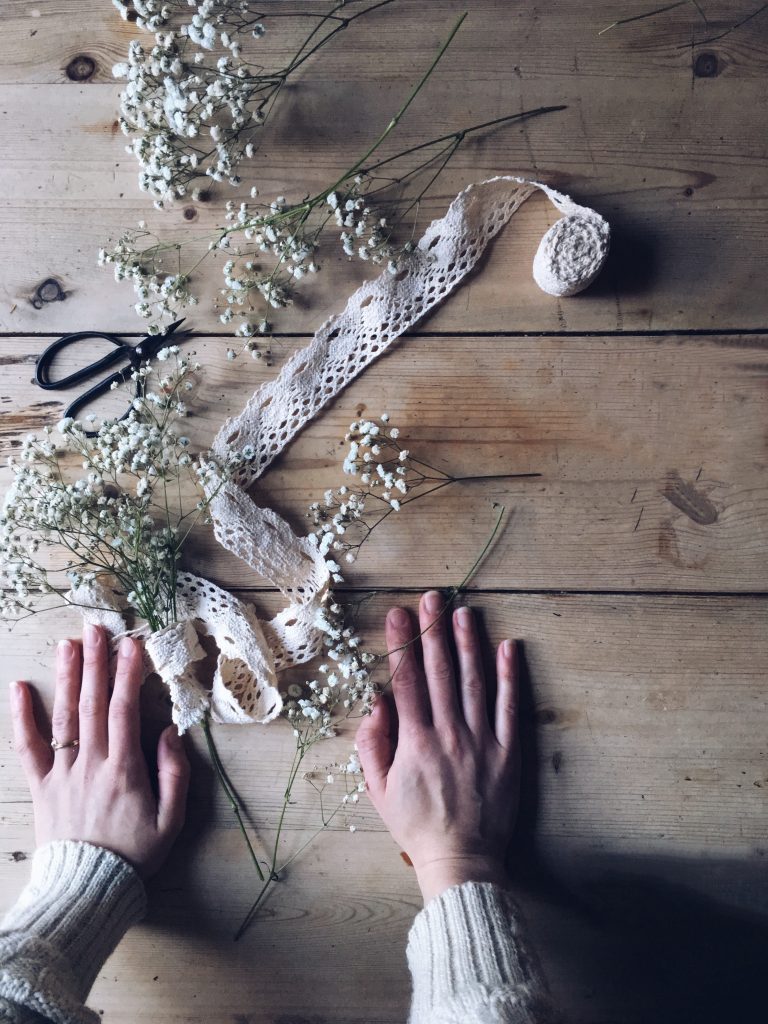 bunch of gypsophila baby's breath lace ribbon hands