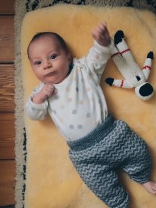 52 project one month baby on sheepskin rug